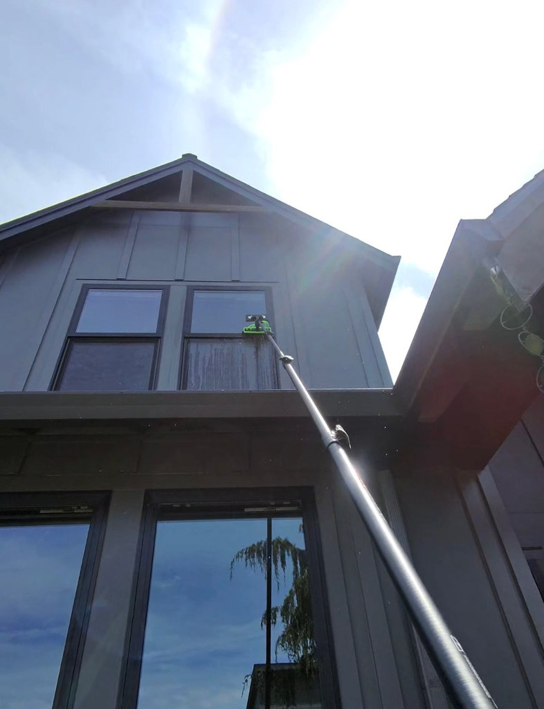 An extension pole reaching a second-story gable window